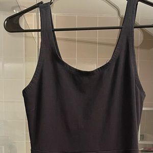 Express black fit & flare skater style dress with cool teal zipper back.